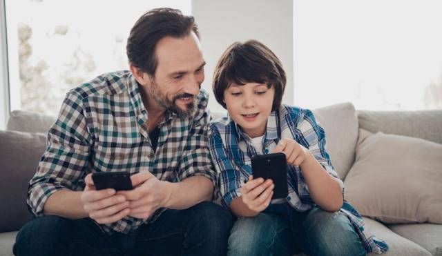 Dad and Son looking at phone